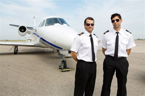 Pilots Standing in Front of Private Jet Stock Photo - Image of aircraft ...