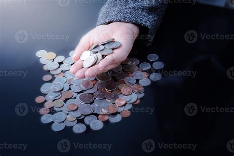 Businesswoman is having hands full of coins 1064393 Stock Photo at Vecteezy