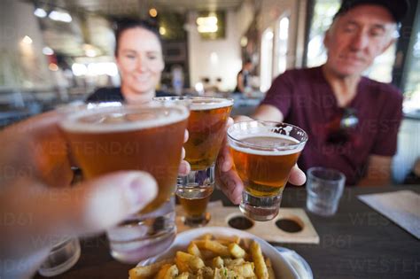 Celebratory toast with beer stock photo