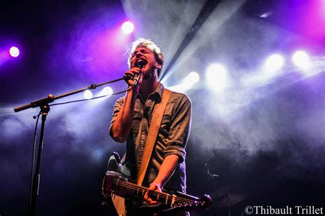 Man Singing on Stage With Strobe Lights and Guitar · Free Stock Photo