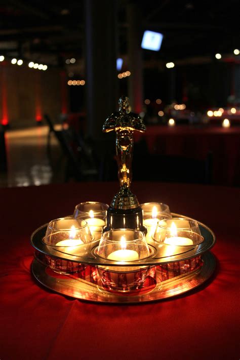 Table decor ... gold metal movie reel & plastic Oscar style statute ...