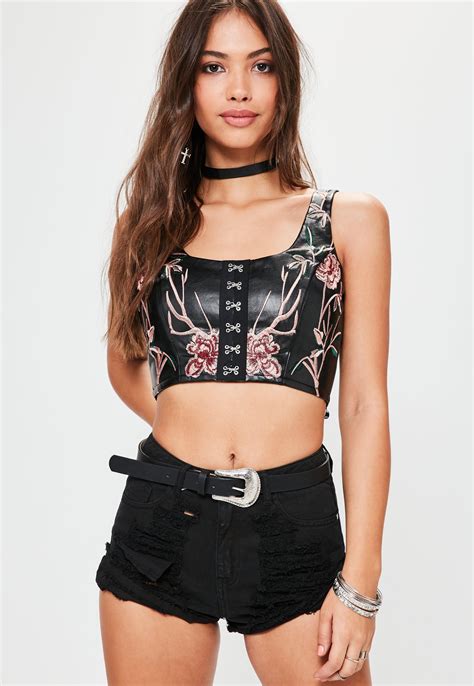 It's all in the details! This crop top features pretty floral ...