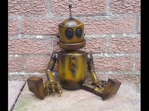 WELDING UP RECYCLED SCRAP METAL INTO A SEATED ROBOT SCULPTURE - YouTube