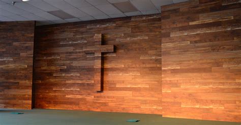 Wood wall backdrop for church stage. The cross has soft lighting behind ...