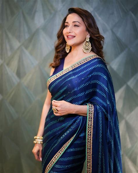 Madhuri Dixit looks effortlessly graceful in a blue saree!