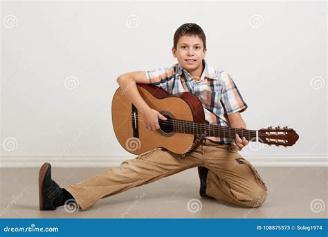 Boy Having Fun with Guitar, Making Music and Singing Stock Image ...