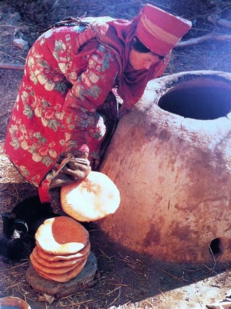 Afghani woman in front of the traditional oven, Afghanistan, Roland et ...