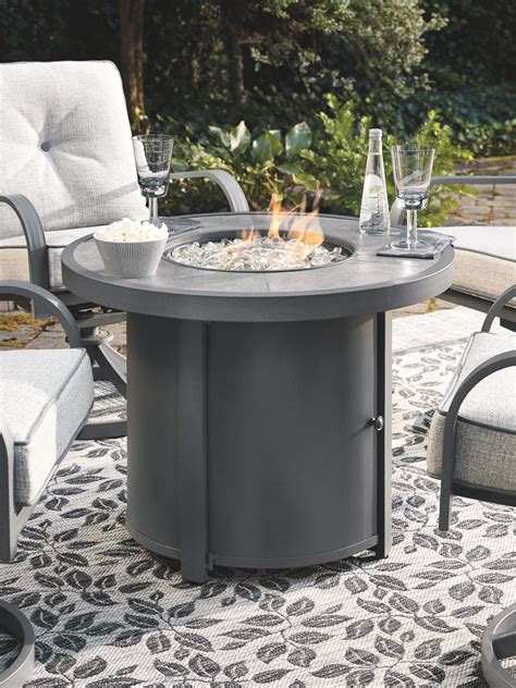 Donnalee Bay - Dark Gray - Round Fire Pit Table - EZ Furniture Sales ...