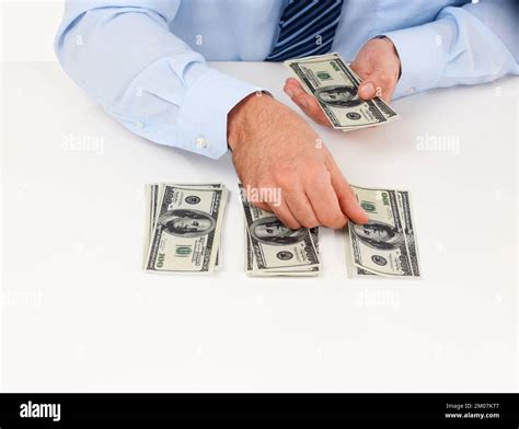 Counting his cash. a male counting American money Stock Photo - Alamy