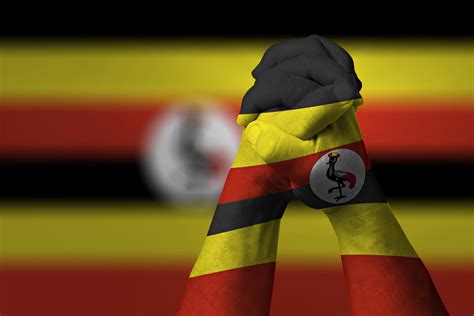 man-clasped-hands-patterned-uganda-flag | Uganda flag, Uganda ...