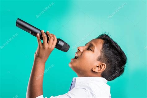 Little asian kid singing | Young indian boy in white shirt yelling in ...