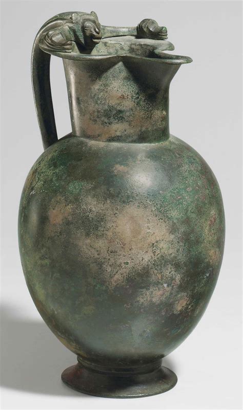 A GREEK BRONZE OINOCHOE , CLASSICAL PERIOD, CIRCA EARLY 5TH CENTURY B.C ...