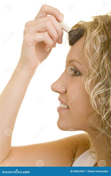 Woman applying face powder stock photo. Image of blond - 6865496