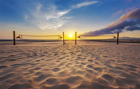 Download Two Beach Volleyball Nets At Sunrise Wallpaper | Wallpapers.com