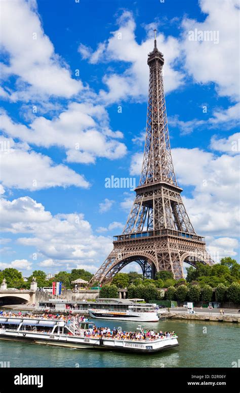 Bateaux Mouches tour boat on River Seine passing the Eiffel Tower ...