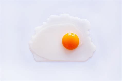 Premium Photo | Raw egg yolk