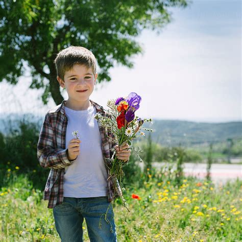 "Kid Picking Flowers" by Stocksy Contributor "CACTUS Creative Studio ...