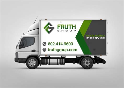 the truck is white and green with black lettering on it's side, which ...