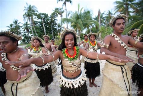 In this recent picture, natives from Kiribati are performing a ...