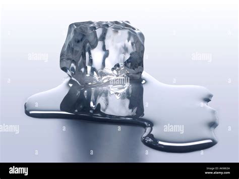 MELTING ICE CUBE WITH MELTED WATER Stock Photo: 2786873 - Alamy