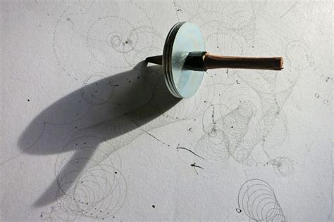 Drawing made by spinning top made of metal discs and a pencil | What is ...