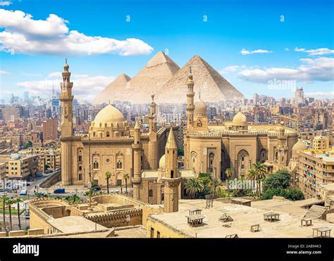 View of the Mosque Sultan Hassan in Cairo and pyramids Stock Photo - Alamy