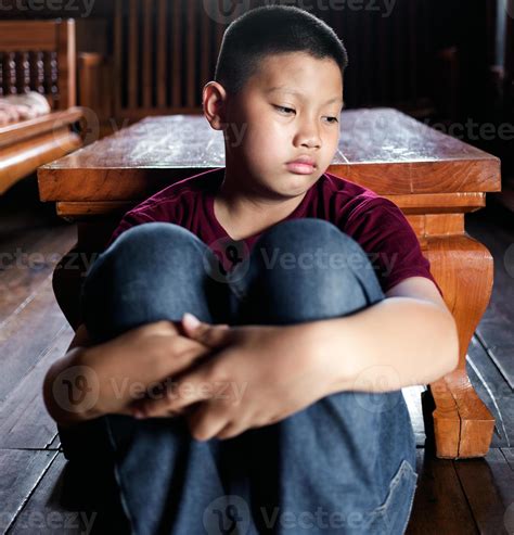 Portrait of a little Asian boy, Kid sad face, Unhappy child sitting hug ...