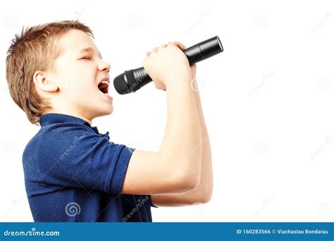 Teenage Boy Singing into a Microphone. Very Emotional Stock Photo ...