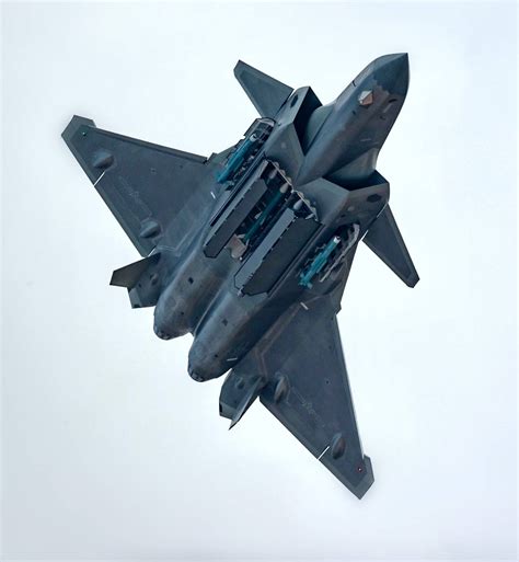 J-20 with weapons bays open and training rounds visible, most likely at ...