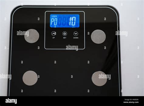 Electronic scale showing visceral fat measurement of a woman which is ...