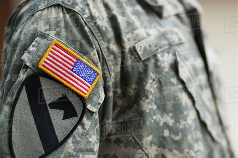 American flag patch on soldier's uniform - Stock Photo - Dissolve