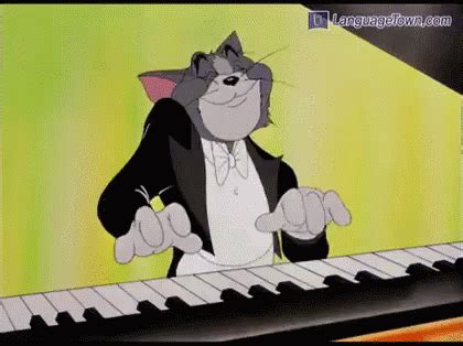 a cartoon cat playing the piano while wearing a tuxedo