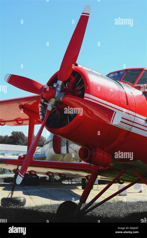 The front of the red plane against the sky and other planes Stock Photo ...