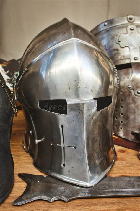 Shiny Metal Helmets of Medieval Knights with Traditional Weapons at a ...