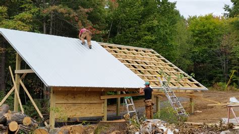 Installing galvanized aluminum roofing on tool shed ~ Mary G. Holland