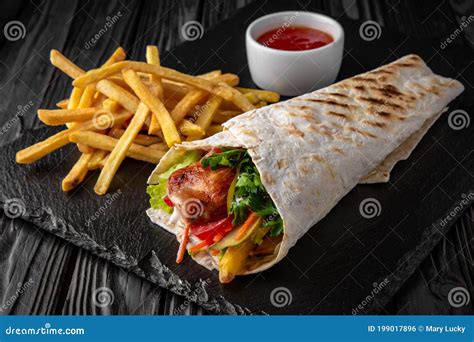 A Delicious Doner Donair Kebab Wrap With Meat, Lettuce, Tomato, Red ...