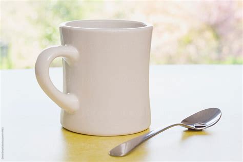 "Retro Coffee Mug And Spoon On Diner Counter Near Window" by Stocksy ...