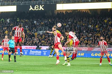 VIDA of AEK FC competing with 74 ANDREAS NTOI of Olympiacos FC during ...