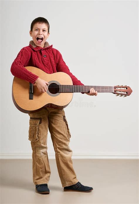 Boy Having Fun with Guitar, Making Music and Singing Stock Photo ...