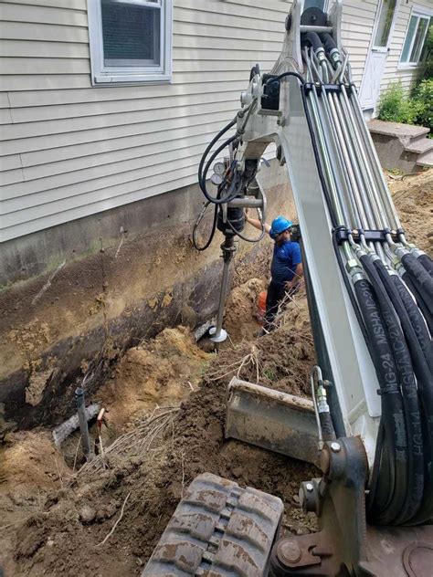 Settling Manufactured Home, Goffstown, NH - Installing Helical Piers