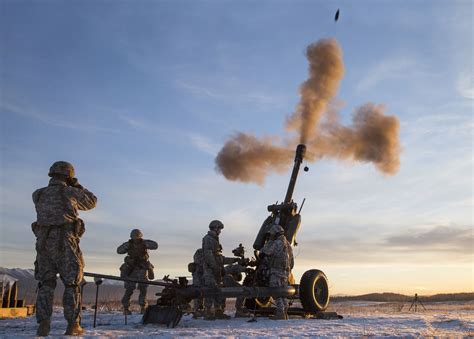 US Army paratroopers in Alaska firing a M119 105mm howitzer [4864 x 3483]