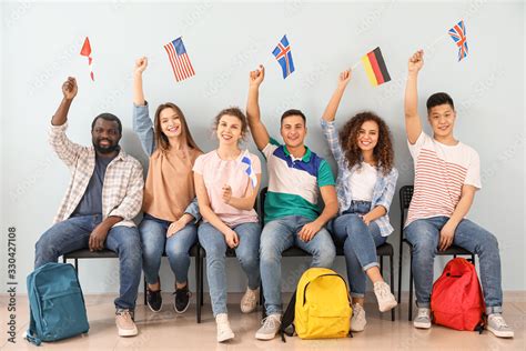 Young students of language school near color wall Stock Photo | Adobe Stock