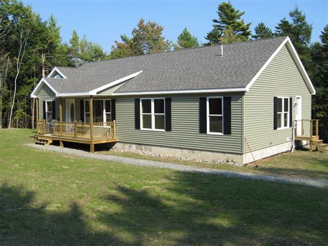 Modular ranch exterior with green siding and black shutters. | Ranch ...