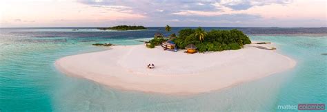 - Aerial view of island at sunset, Maldives | Royalty Free Image