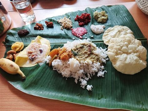 Premium Photo | Kerala onam sadhya meals in banana leaf