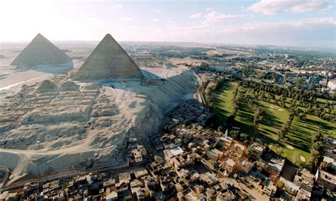 The 4500 year old Great Pyramids of Giza in the backdrop of the slums ...