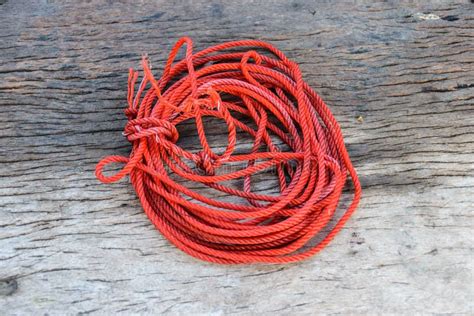 Red Rope On Wooden Background Stock Image - Image of blue, clipping ...