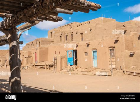 Adobe houses in the historical Native American village of Taos Pueblo ...