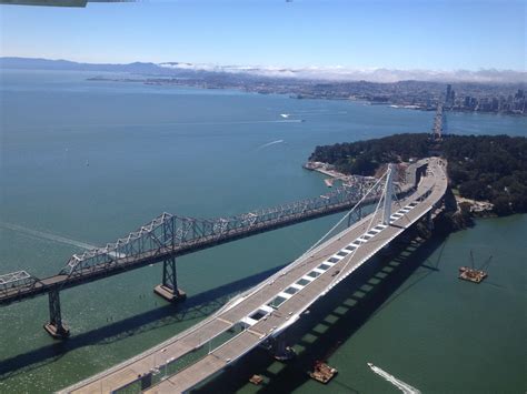 The old and new San Francisco Bay Bridges being swapped from my flight ...