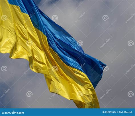 Ukraine Flag Waving on the Wind Against the Blue Sky Stock Photo ...